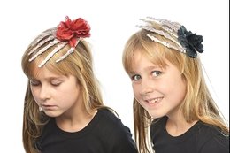 CLIP CHEVEUX MAIN SQUELETTE ET FLEUR ROUGE 17X9.5 CM